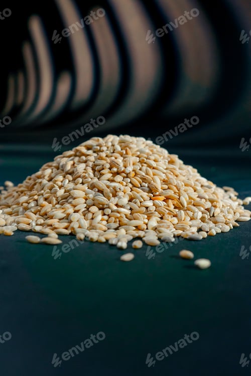 Preview: yellow wheat close-up lies on black and blue background Ukrainian culture, light protein food