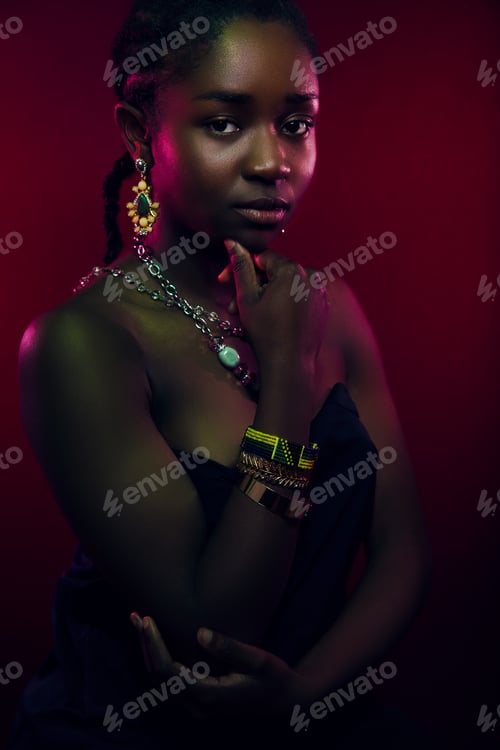 Preview: Colorful portrait of sensuous woman wearing jewelry over red background