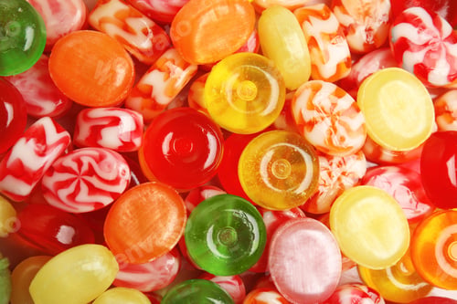 Preview: Different delicious colorful candies as background, top view