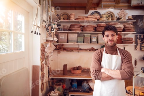 Preview: Portrait Of Male Potter Wearing Apron In Ceramics Studio