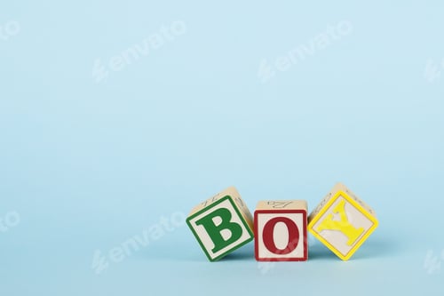 Preview: Blue background with colored cubes with letters Boy, giving birth to a baby boy, toys for toddlers
