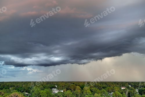 Preview: Landscape of dark ominous clouds forming on stormy sky during heavy thunderstorm
