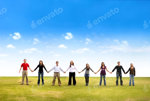Preview: Casual Group Of Friends Holding Hands Outdoors In A Park On A Beautiful Day