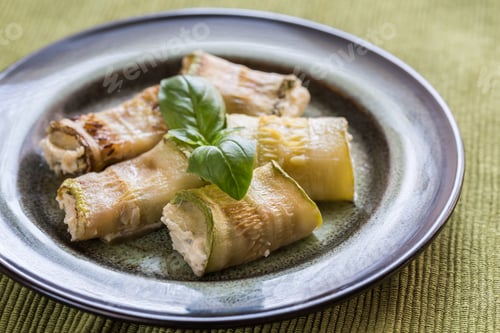 Preview: Portion of baked zucchini rolls stuffed with cheese