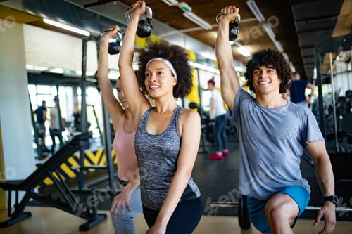 Picture of cheerful fitness team in gym