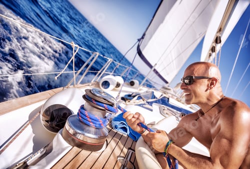 Preview: Handsome strong man working on sailboat