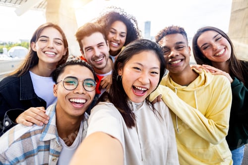 Preview: Diverse group of happy young best friends having fun taking selfie together