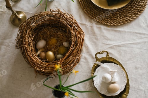 Preview: Easter Table with a Basket of Eggs and a Vase of Flower