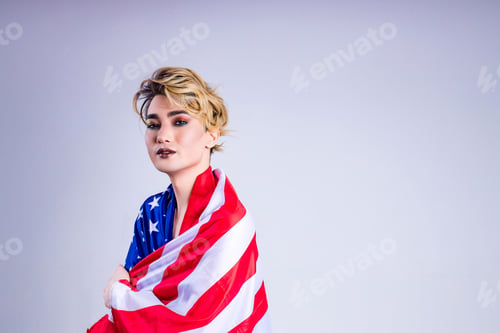 Preview: Closeup portrait of a young man with a lipstick over white background