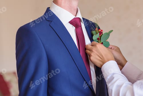 Preview: Best Man Adjusting Groom's Boutonniere close-up