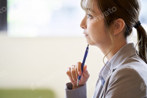 Preview: Asian woman worried while working at a cafe