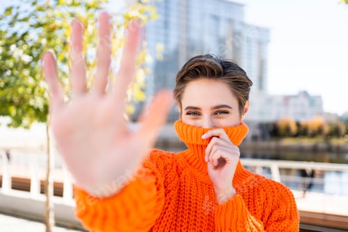 Preview: Beautiful young woman with short hair in the city