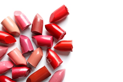 Preview: Collection of lipsticks on white background, top view