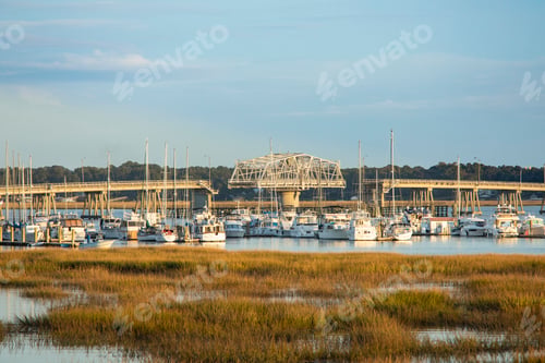 Preview: View of the Woods Bridge turning in Beaufort, South Carolina with boats in the foreground.