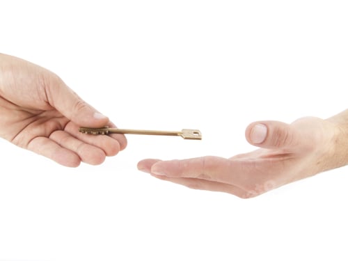 Preview: Male hand holding golden key