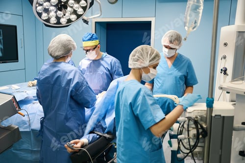 Preview: Surgical team performs an operation in a sterile operating room