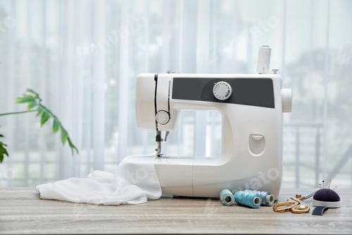 Preview: Sewing machine on table near window indoors