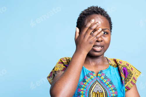 Preview: Feminine pretty girl feeling petrified and scared in studio