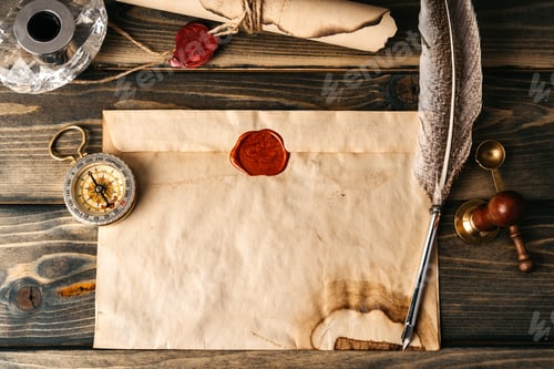 Preview: Quill pen and old paper sheet on wooden background