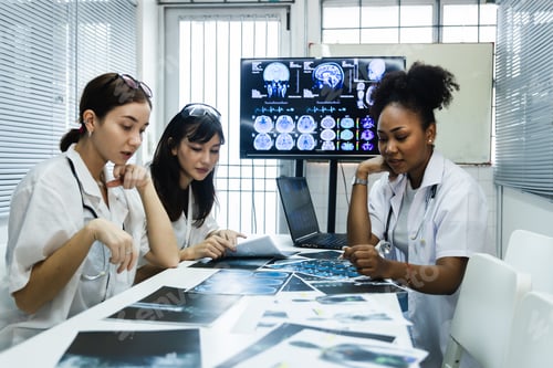 Preview: Team of female doctor check on scan results paper in laboratory and plan share medical knowledge