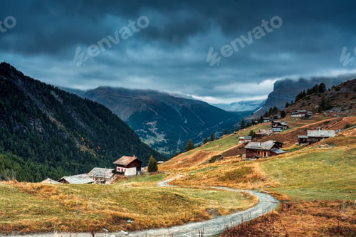 Preview: Matterhorn iconic mountain and small village of wooden huts on the hill at Zermatt, Switzerland