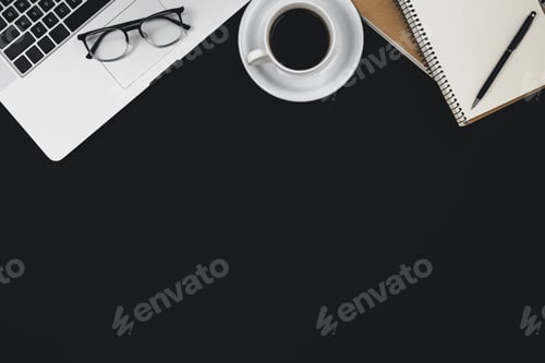 Preview: Black background with laptop, notepads, coffee cup and glasses.