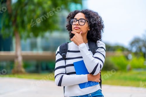 Preview: University student stranding hand on chin and thoughtful expression
