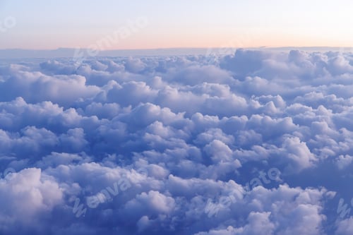 Preview: Sunset above the clouds from airplane