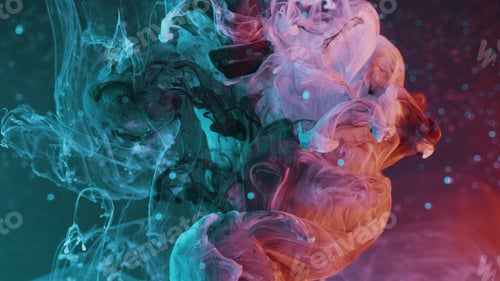 Preview: Closeup of the abstract colorful paint being dropped in the water