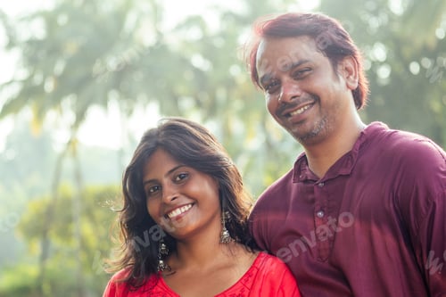 Preview: Young attractive indian couple feeling tenderness and hugging each other