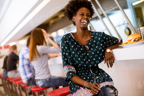 Preview: Young african american woman in the diner