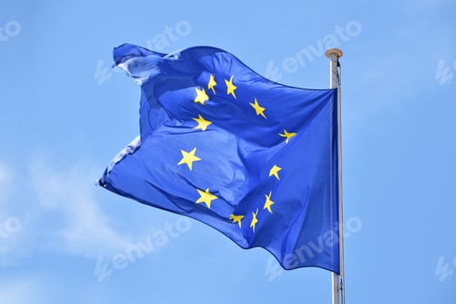 Preview: Close up flag of EU waving in wind over blue sky