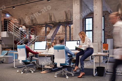 Preview: People working in big modern office