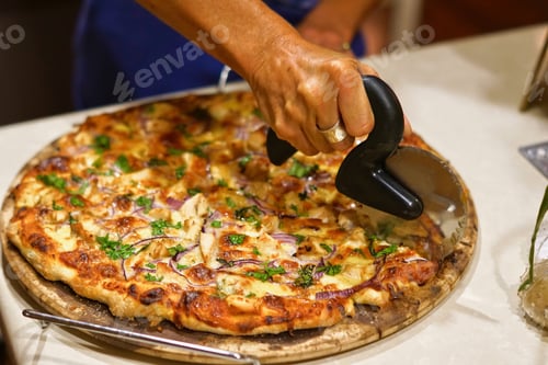 Cutting a Tasty Pizza at Home Indoors