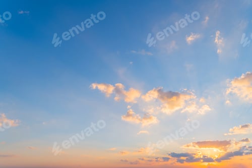 Preview: Sunset sky. Abstract nature background. Dramatic blue and orange, colorful clouds at twilight time.