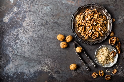 Preview: Walnut kernels and whole walnuts on rustic old wooden table