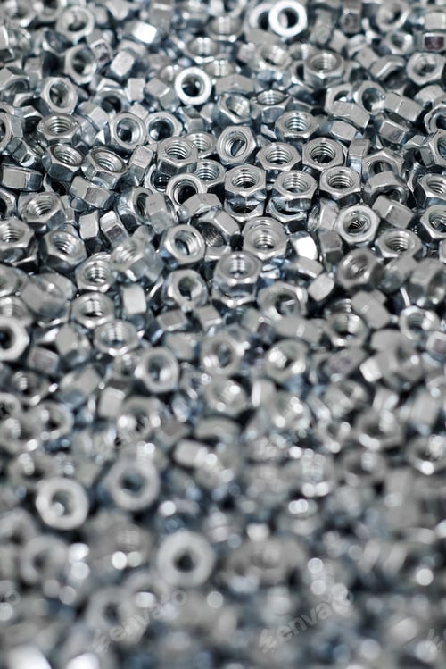 Preview: Bunch of galvanized hexagon nuts for bolts for fasten multiple parts together, hardware fasteners