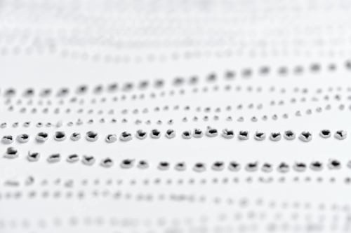 Preview: Perforated pattern on surface of paper. Close-up texture