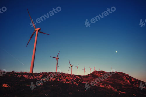 Preview: Solar wind turbines at sunset.