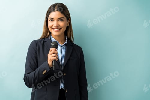 Preview: Pretty Businesswoman Giving Speech In Studio