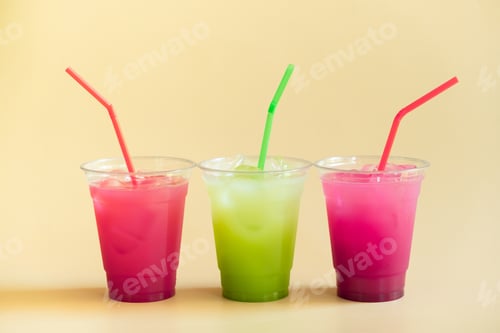 Preview: Colored summer lemonades on beige background