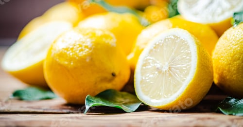 Preview: Fresh lemons. On wooden table.