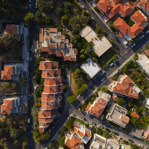 Preview: Aerial photo of a block district of modern buildings with red roofs
