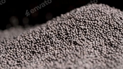 Preview: Close up of aesthetically beautiful pile of black pepper seeds or peppercorns isolated on black