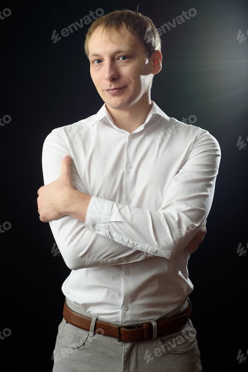 Preview: Close up portrait of a young man in a white shirt and black tie.