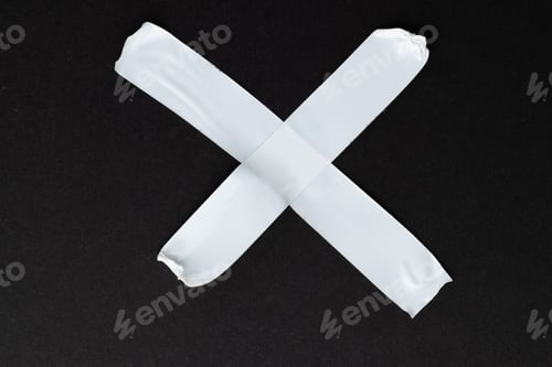 Preview: Ripped up pieces of white tape with copy space on black background