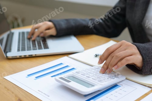 Preview: close up of accountants or female bankers calculating income Company expenses and profits Concepts o
