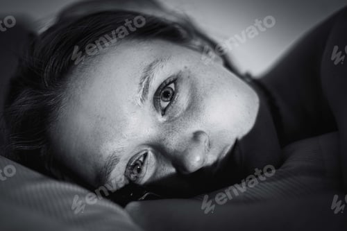 Preview: Portrait of a lying european woman in grayscale