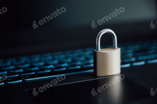 Preview: A golden padlock placed on laptop computer keyboard