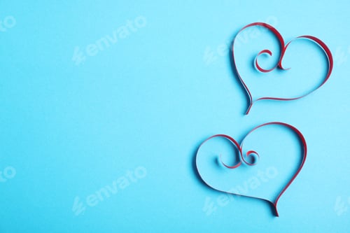 Preview: Hearts made of paper strips on color background, top view. Space for text